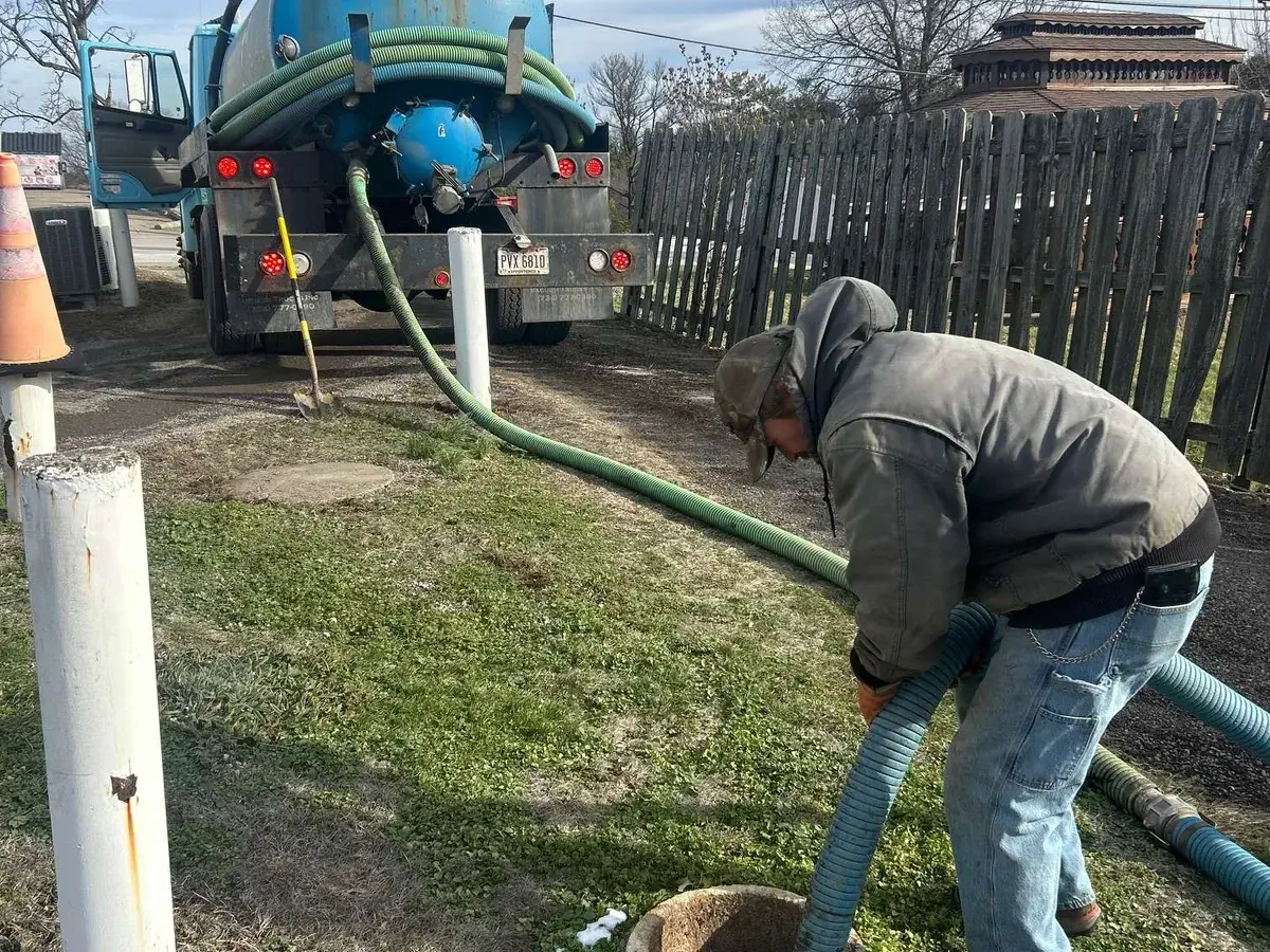 A Wetherell technician pumping a septic tank in the Ohio Valley